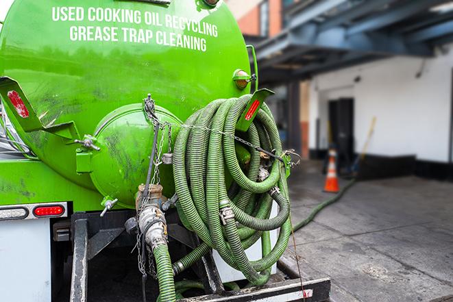 septic tank pump truck in operation in Fresno, TX